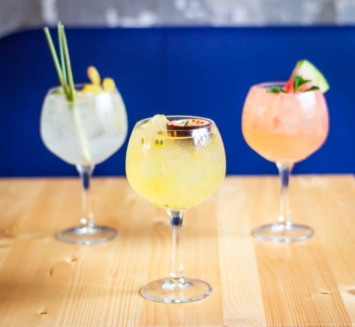 three clear drinking glass on table