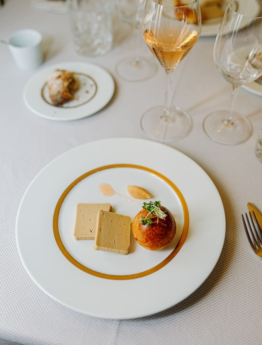 a white plate topped with food on top of a table