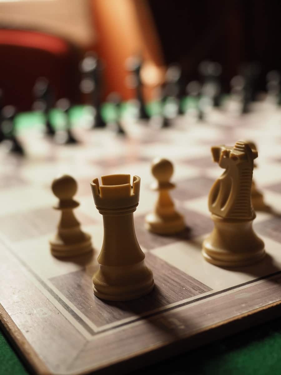 brown chess piece on table