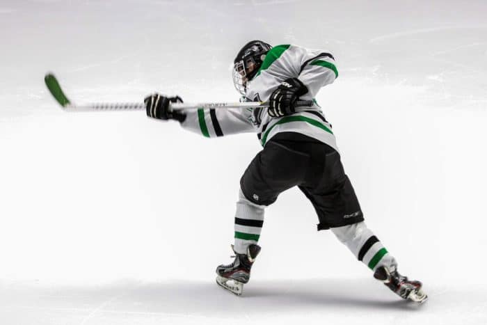Match de hockey - Grenoble VS Bordeaux 1 man wearing green and white ice hockey jersey while playing